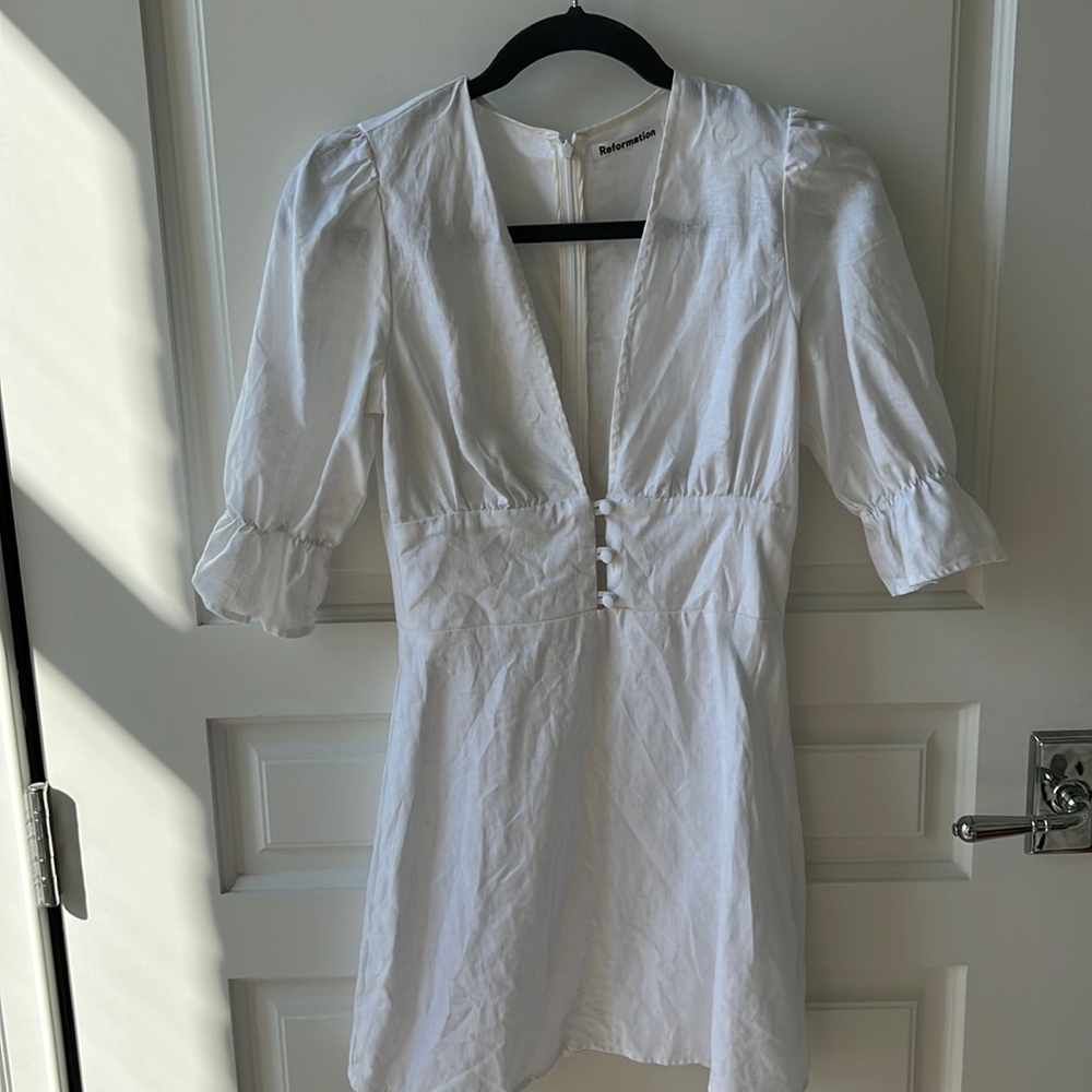 White low cut Reformation mini dress. Worn once, almost perfect condition